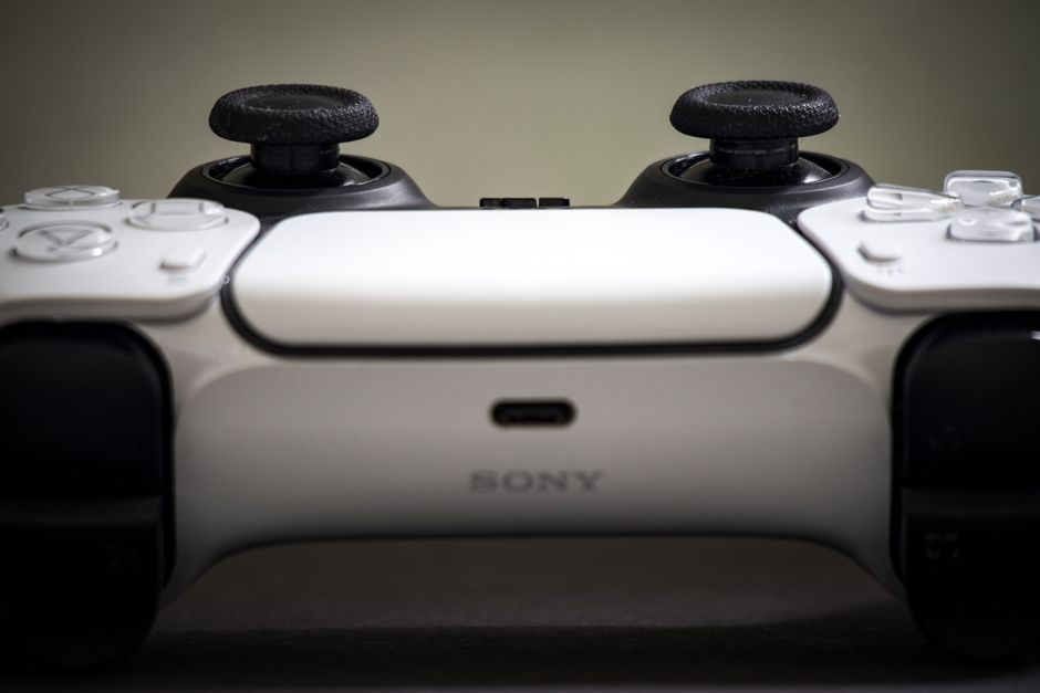 Detailed view of a Sony PlayStation 5 DualSense controller, highlighting design and features.